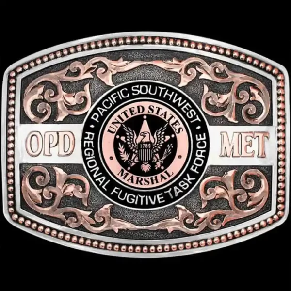 Commemorate your service with the Fort Sam Houston Custom Belt Buckle.  Featuring copper scrollwork on a silver matted base and a custom sheriff logo. Personalize this belt buckle today!